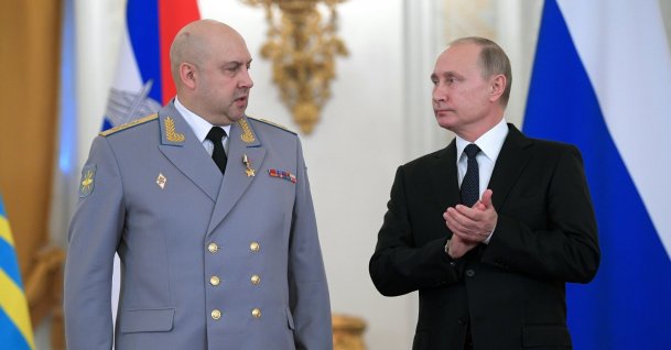 Russian President Vladimir Putin (R) applauds Col. Gen. Sergei Surovikin during an awards ceremony for troops who fought in Syria, in the Kremlin, in Moscow, Russia, Dec. 28, 2017. Russia's Defense Ministry announced that air force chief, Gen. Sergei Surovikin, would be the commander of all Russian troops fighting in Ukraine. The statement marked the first official appointment of a single commander for the entire Russian force in Ukraine. (AP File Photo)