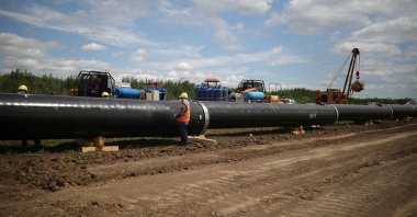 Workers stand near a pipe at a construction site on the extension of Russia's TurkStream gas pipeline in Letnitsa, Bulgaria, June 1, 2020. (Reuters Photo)