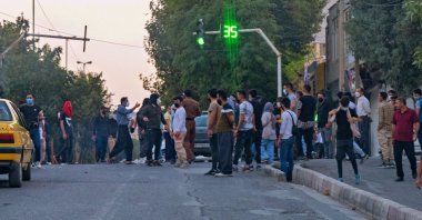 Iranians protest following the controversial death of a young Iranian woman while in custody by the "morality police," Sanandaj, Iran, Sept. 19, 2022. (AFP Photo)