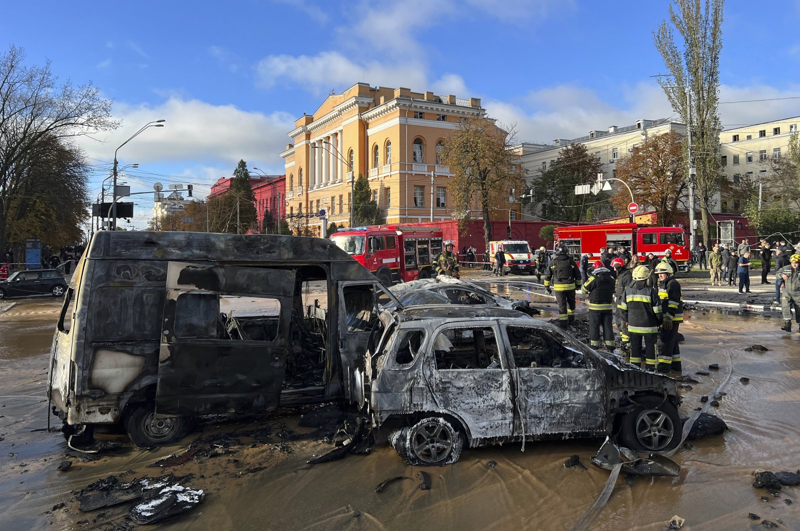 Rescue workers survey the scene of a Russian attack on Kyiv, Ukraine, Oct. 10, 2022. (AP Photo)