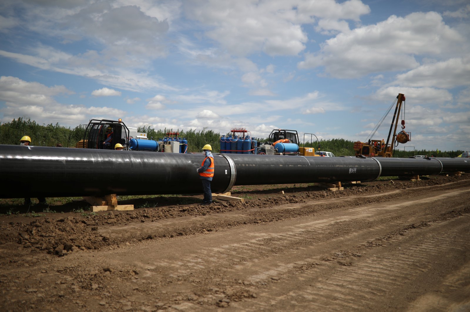 Workers stand near a pipe at a construction site on the extension of Russia&#039;s TurkStream gas pipeline in Letnitsa, Bulgaria, June 1, 2020. (Reuters Photo)