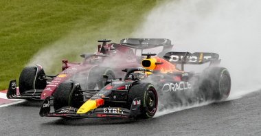 Monaco&#039;s Formula One driver Charles Leclerc (back) of Scuderia Ferrari and Dutch Formula One driver Max Verstappen of Red Bull Racing fight for position at the start of the Formula One Grand Prix of Japan at the Suzuka International Racing Course, Suzuka, Japan, Oct. 9, 2022.  (EPA Photo)
