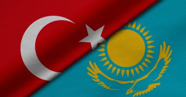 The flags of Türkiye and Kazakhstan are seen side by side in this illustration photo. (Shutterstock Photo)