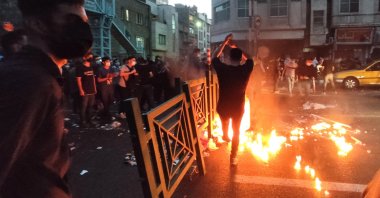 People clash with police during a protest following the death of Mahsa Amini, Tehran, Iran, Sept. 21, 2022. (EPA Photo)