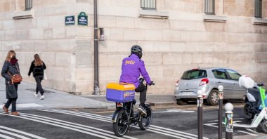 A Getir deliverer rides a bike in the streets of Paris, France, Jan. 20, 2022. (Shutterstock Photo)