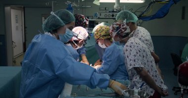 Doctors performing the first ever multi-visceral intestinal transplant from a controlled pediatric donor in asystole to a 13-month baby girl, Madrid, Spain, Oct. 11, 2022. (La Paz Hospital Handout via Reuters)
