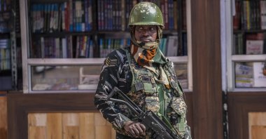 An Indian paramilitary soldier stands guard at a checkpoint in Srinagar, Indian-controlled Kashmir, Oct. 5, 2022. (AP Photo)