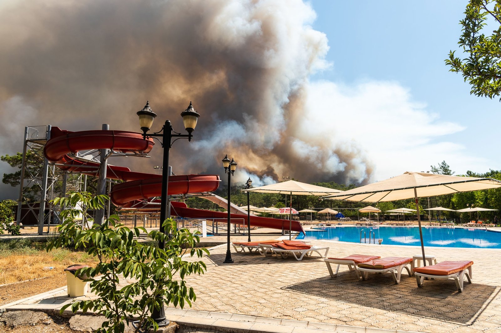 Smoke rises from a forest fire in Marmaris, Muğla, Türkiye, July 30, 2021. (Shutterstock Photo)