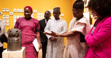 Ngaire Blankenberg, director of the National Museum of African Art, and the Honorable Minister of Information and Culture Lai Mohammed view the Benin Bronze artwork after a repatriation ceremony at the Smithsonian National  Museum of African Art, Washington, U.S., Oct. 11, 2022. (AP Photo)