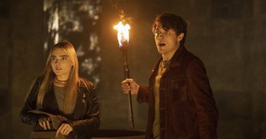 This image released by The CW shows Meg Donnelly (L) and Drake Rodger in a scene from &quot;The Winchesters,&quot; a prequel to the long-running series &quot;Supernatural.&quot; (AP Photo)