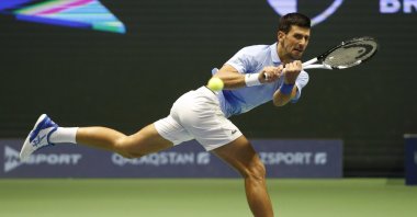 Serbia&#039;s Novak Djokovic returns the ball to Stefanos Tsitsipas of Greece during their ATP 500 Astana Open tennis tournament final match, Astana, Kazakhstan, Oct. 9, 2022. (AP Photo)
