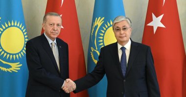 President Recep Tayyip Erdoğan and Kazakh President Kassym-Jomart Tokayev shake hands during a meeting in Astana, Kazakhstan, Oct. 12, 2022. (AFP Photo)