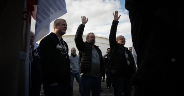 Workers vote in favor of the renewal of their strike at the Gravenchon-Port-Jerome refinery, owned by U.S. giant Esso-ExxonMobil, in Port-Jerome, Normandy, Oct. 12, 2022. (AFP Photo)