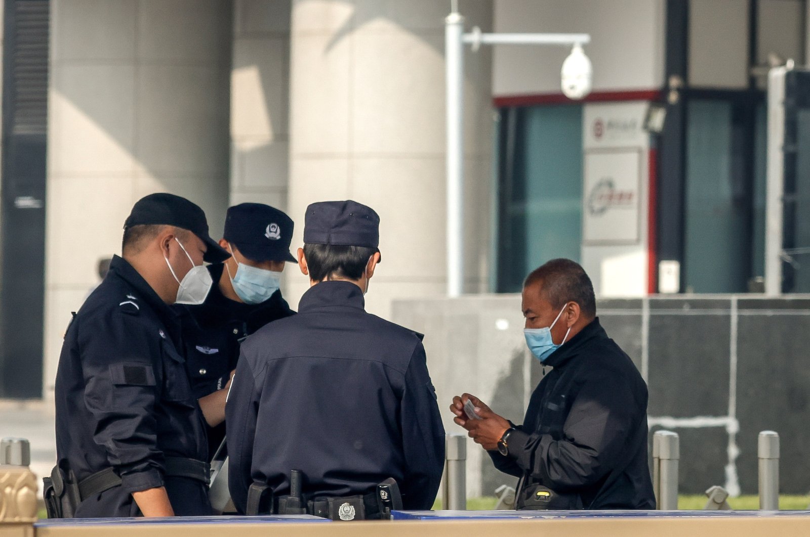 Security offiers check a man&#039;s identification before entering the vicinity of Tiananmen Square. Beijing, China, Oct. 12 2022. (EPA Photo)
