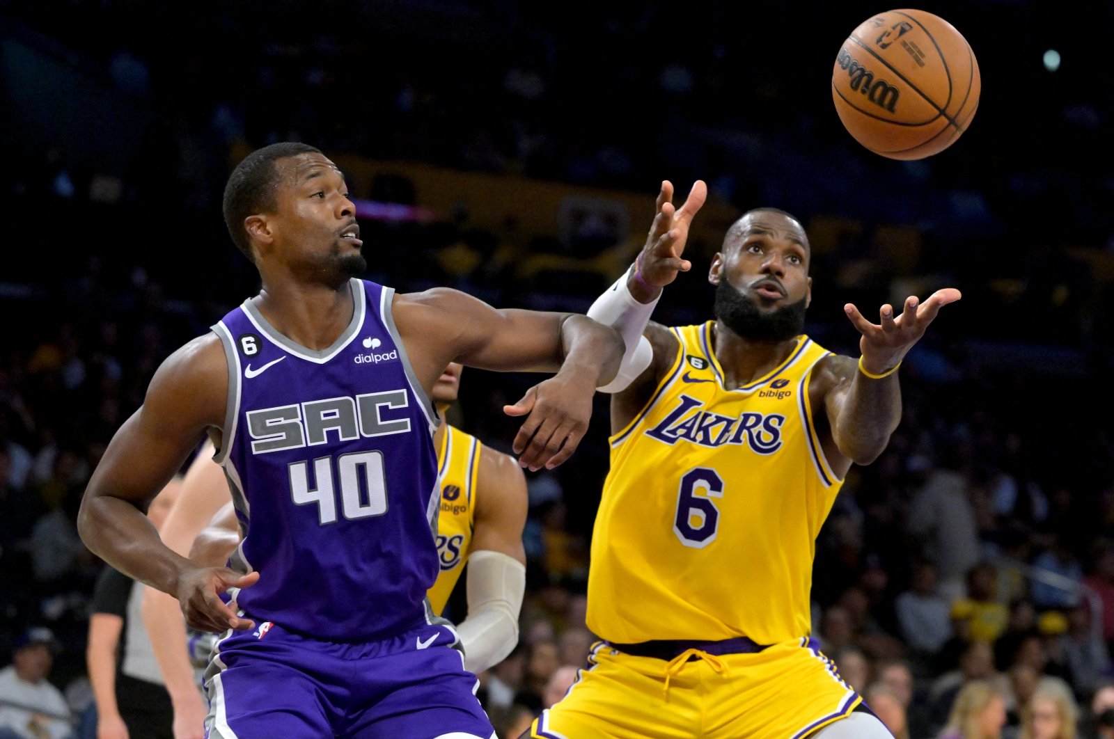 Los Angeles Lakers forward LeBron James (6) and Sacramento Kings forward Harrison Barnes (40) go for a rebound in the first half at Crypto.com Arena. Los Angeles, California, Oct. 3, 2022.  (USA TODAY Sports via REUTERS Photo)
