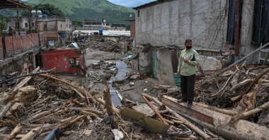 A man stands by the rubble of destroyed houses days after a devastating landslide, Las Tejerias, Aragua state, Venezuela, Oct. 12, 2022. (AFP Photo)