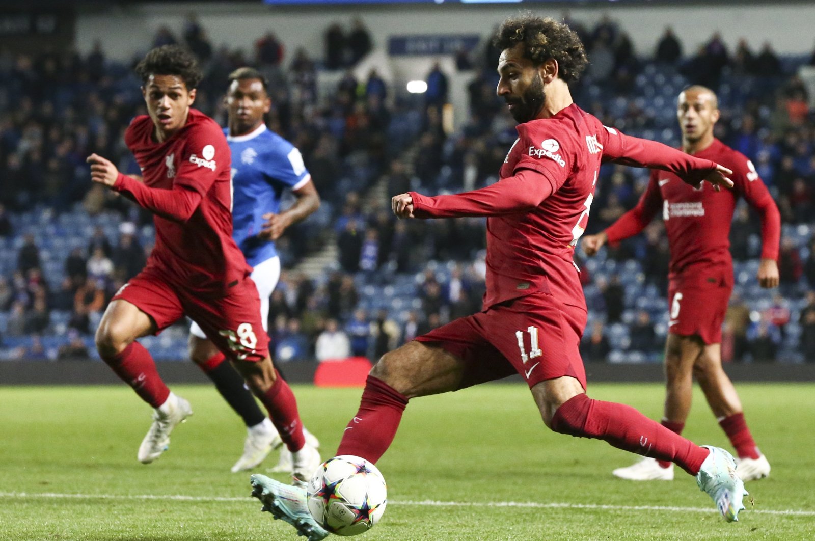 Mohamed Salah (R) of Liverpool in action during the UEFA Champions League group A football match between Rangers FC and Liverpool FC, Glasgow, Britain, Oct. 12, 2022. (EPA Photo)