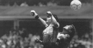 Argentina's Diego Maradona, (L), beats England's goalkeeper Peter Shilton to a high ball and scores his ''Hand of God'' goal at the World Cup quarterfinal match, Mexico City, Mexico, June 22, 1986. (El Grafico via AP)