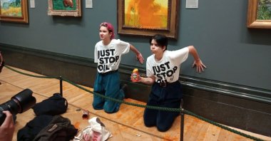 Climate activism group of two protesters who threw Heinz Tomato soup at Vincent Van Gogh&#039;s 1888 painting &quot;Sunflowers&quot; at the National Gallery in London, U.K., Oct. 14, 2022. (Just Stop Oil handout photo via EPA)