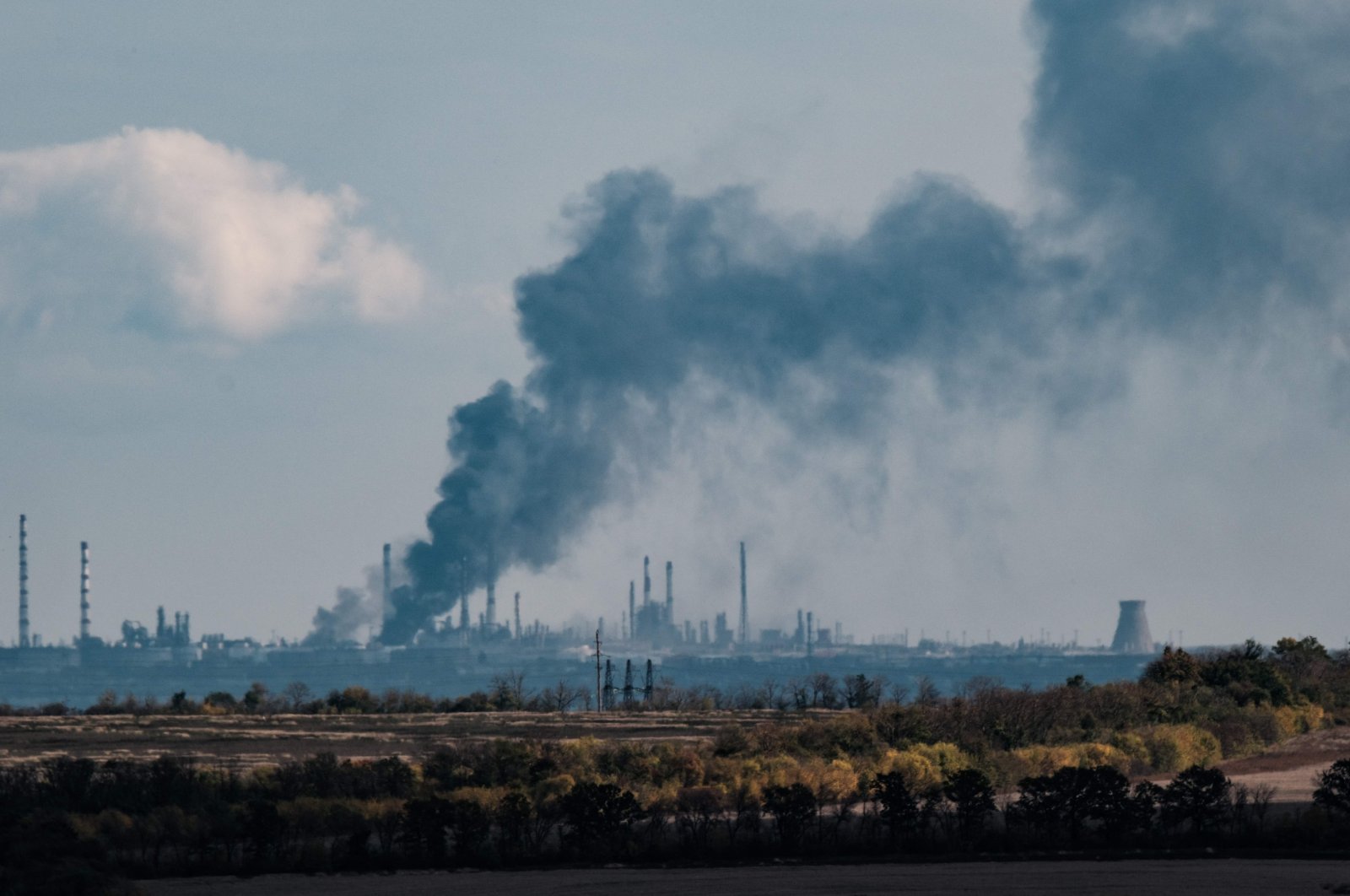 Black smoke is seen near the Slovianska heat power station in the Donetsk region, Ukraine, Oct. 13, 2022. (AFP Photo)