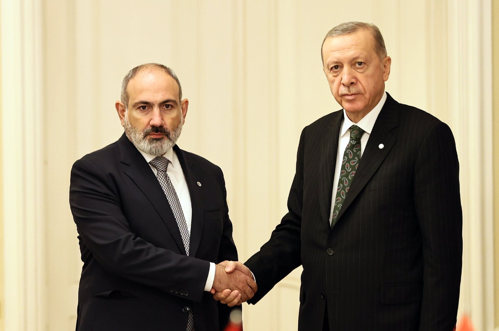 A handout photo made available by the Armenian Government press service shows President Recep Tayyip Erdoğan (R) shaking hands with Armenian Prime Minister Nikol Pashinian (L) during their meeting in Prague, Czech Republic, Oct. 6, 2022. (EPA Photo)