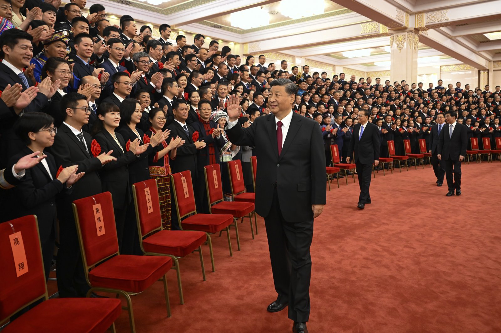 Chinese President Xi Jinping (C) meets with representatives of model civil servants during a national award ceremony held at the Great Hall of the People, Beijing, China, Aug. 30, 2022. (AP Photo)