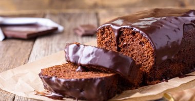 Homemade chocolate cake on baking paper. (Shutterstock Photo)