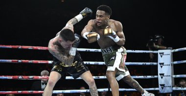 Australia's George Kambosos (L) and Devin Haney (R) of the United States in action during the World Lightweight Title re-match at Rod Laver Arena. Melbourne, Australia, Oct. 16 2022. (EPA Photo)