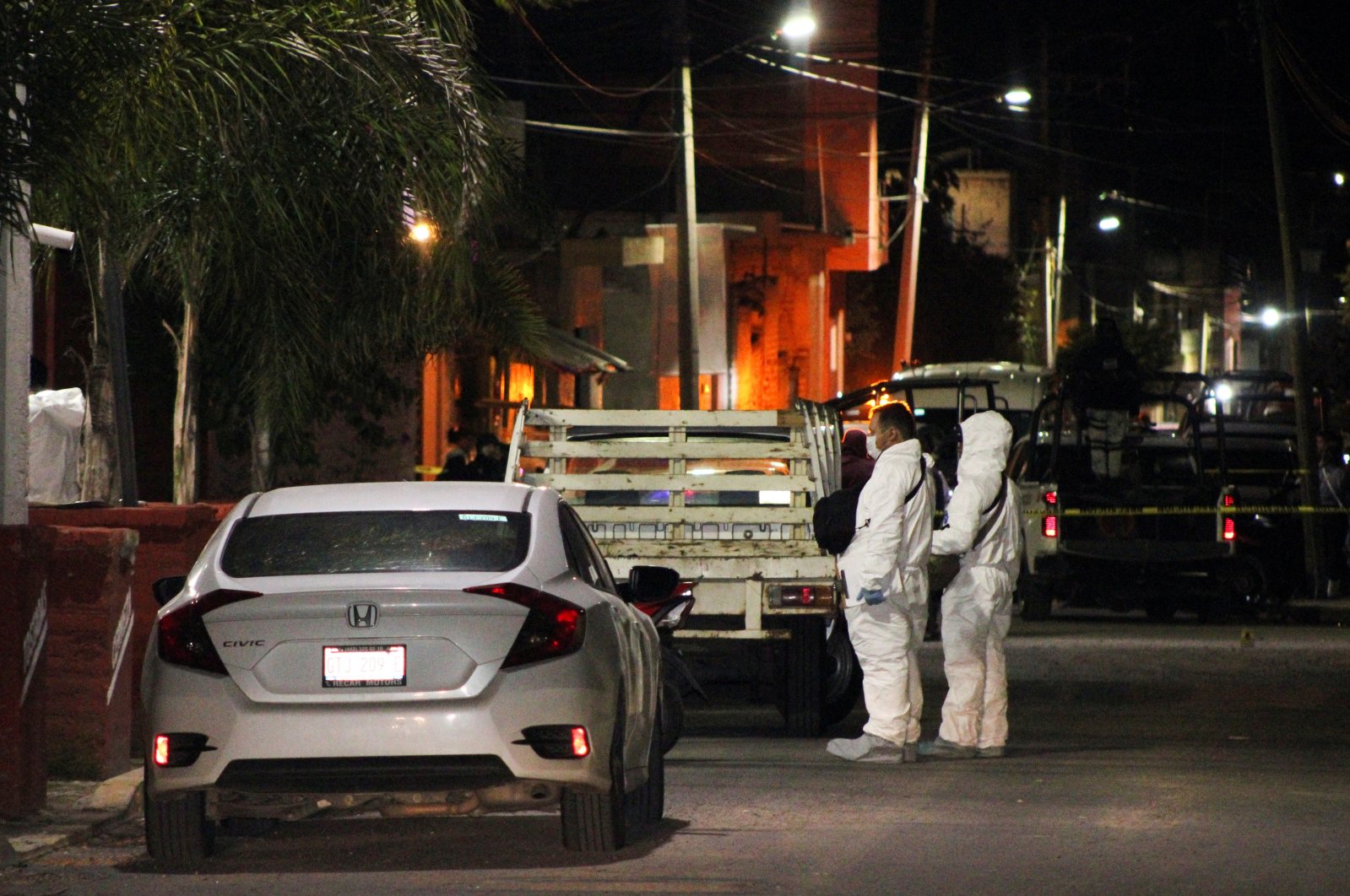 Forensic officers stand outside a bar where unidentified gunmen opened fire killing several people, Tarimoro, Guanajuato state, Mexico, Sept. 21, 2022. (REUTERS Photo)