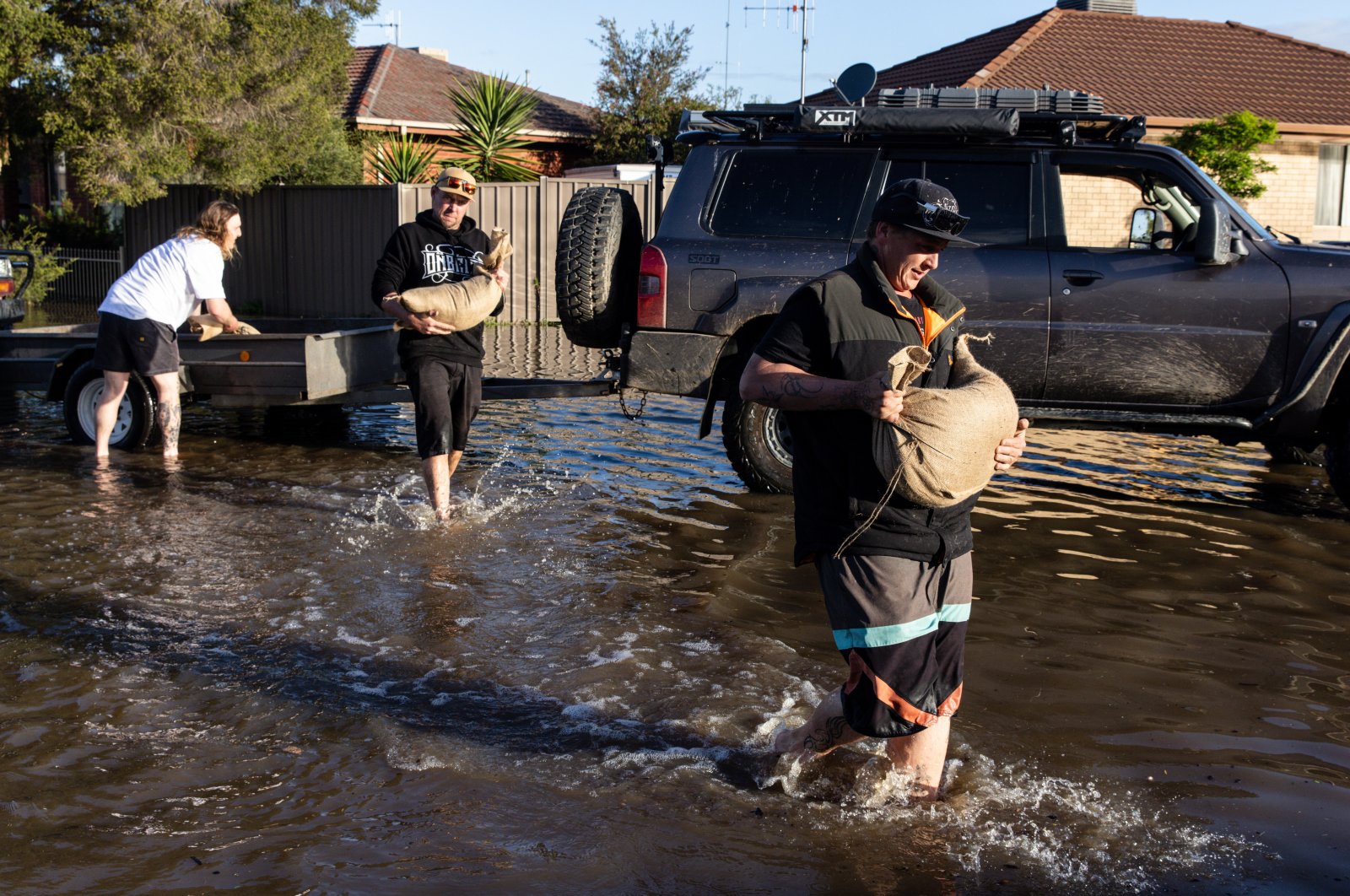Local residents deliver sandbags to houses affected by the flood, Shepparton, Victoria, Australia, Oct. 16 2022. (EPA Photo)