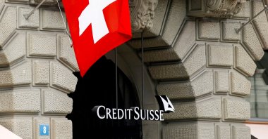 Switzerland&#039;s national flag flies above the logo of Swiss bank Credit Suisse at its headquarters in Zurich, Switzerland, April 18, 2021. (Reuters Photo)