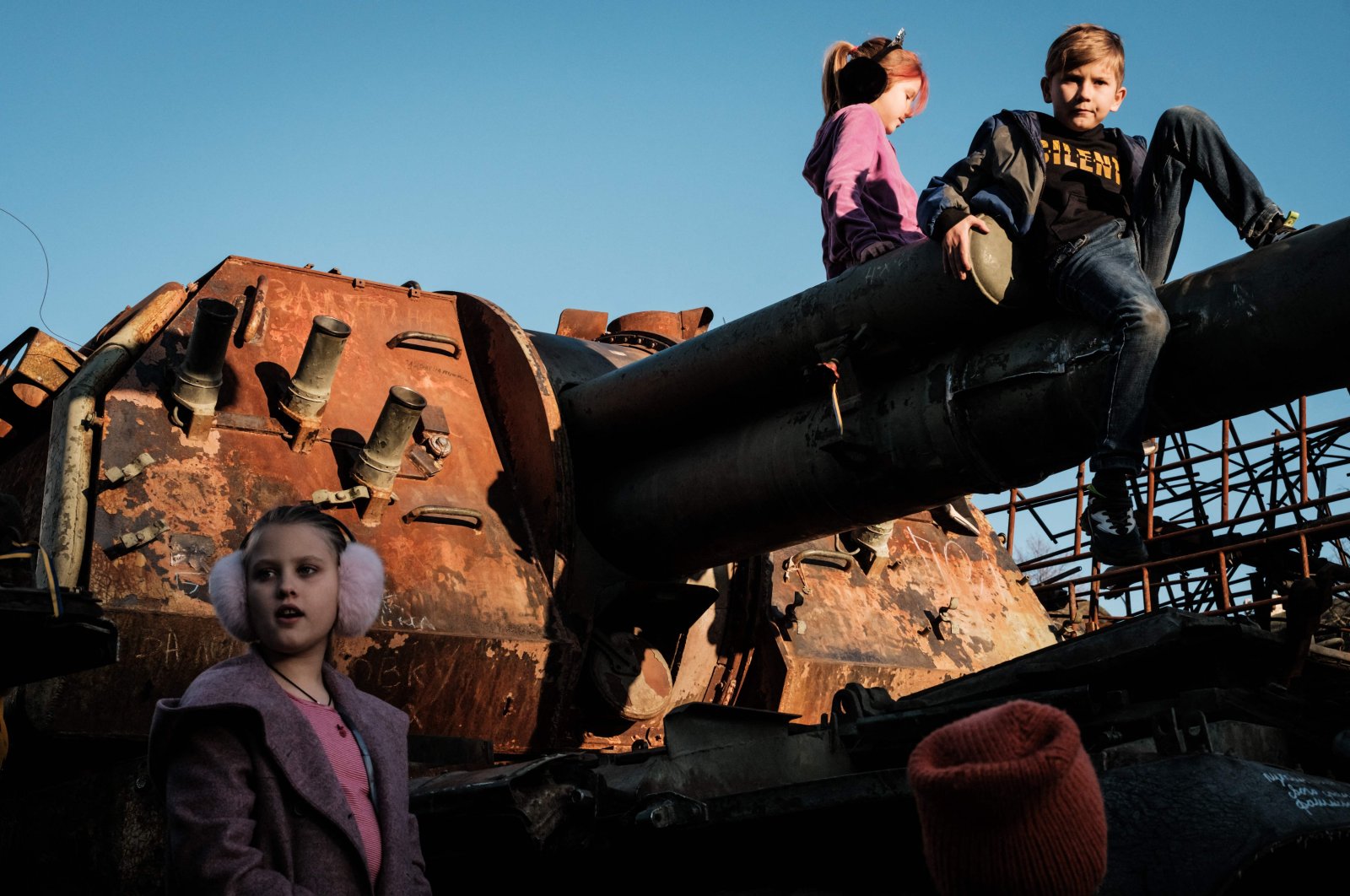 Children climb on a destroyed Russian tank near St. Michael&#039;s Golden-Domed Monastery, Kyiv, Ukraine, Oct. 16, 2022. (AFP Photo)