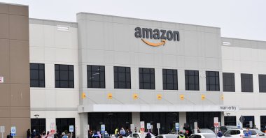 In this file photo taken on March 30, 2020, Amazon workers at Amazon's Staten Island warehouse strike in demand that the facility be shut down and cleaned after one staffer tested positive for the coronavirus in New York. (AFP File Photo)