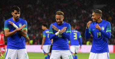Neymar (C) celebrates with his teammates Lucas Paqueta (L) and Raphinha (R) after scoring his team&#039;s third goal during the friendly football match between Brazil and Tunisia at the Parc des Princes, Paris, France, Sept. 27, 2022. (AFP Photo)