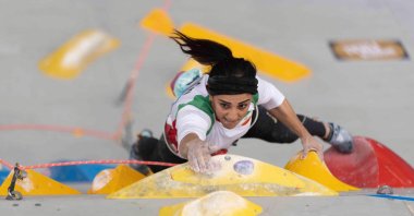 Iranian climber Elnaz Rekabi competing during the women's boulder finals of the Asian Championships of the IFSC in Seoul, South Korea, Oct. 16, 2022. (International Federation of Sport Climbing Handout via AFP)