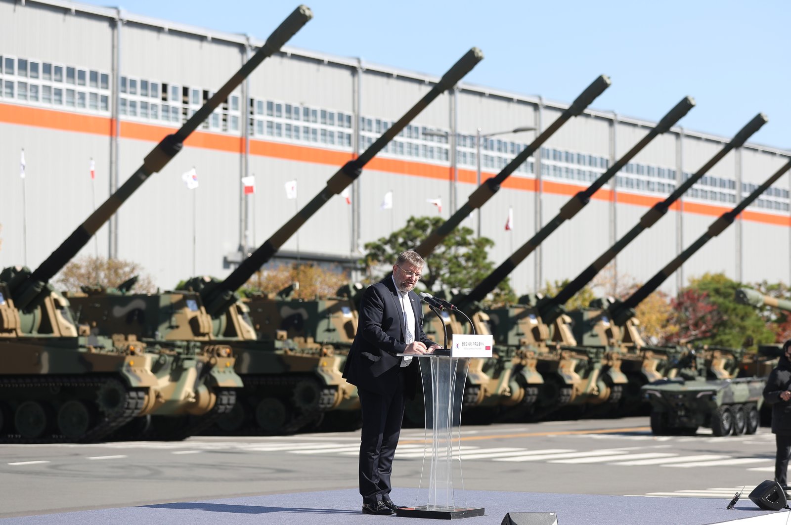 Polish Ambassador to South Korea Piotr Ostaszewski delivers a congratulatory speech during a ceremony to roll out the first K9 self-propelled howitzer to be exported to Poland at Hanwha Defense Co. in Changwon, 301 kilometers southeast of Seoul, South Korea, Oct. 19, 2022. (EPA Photo)