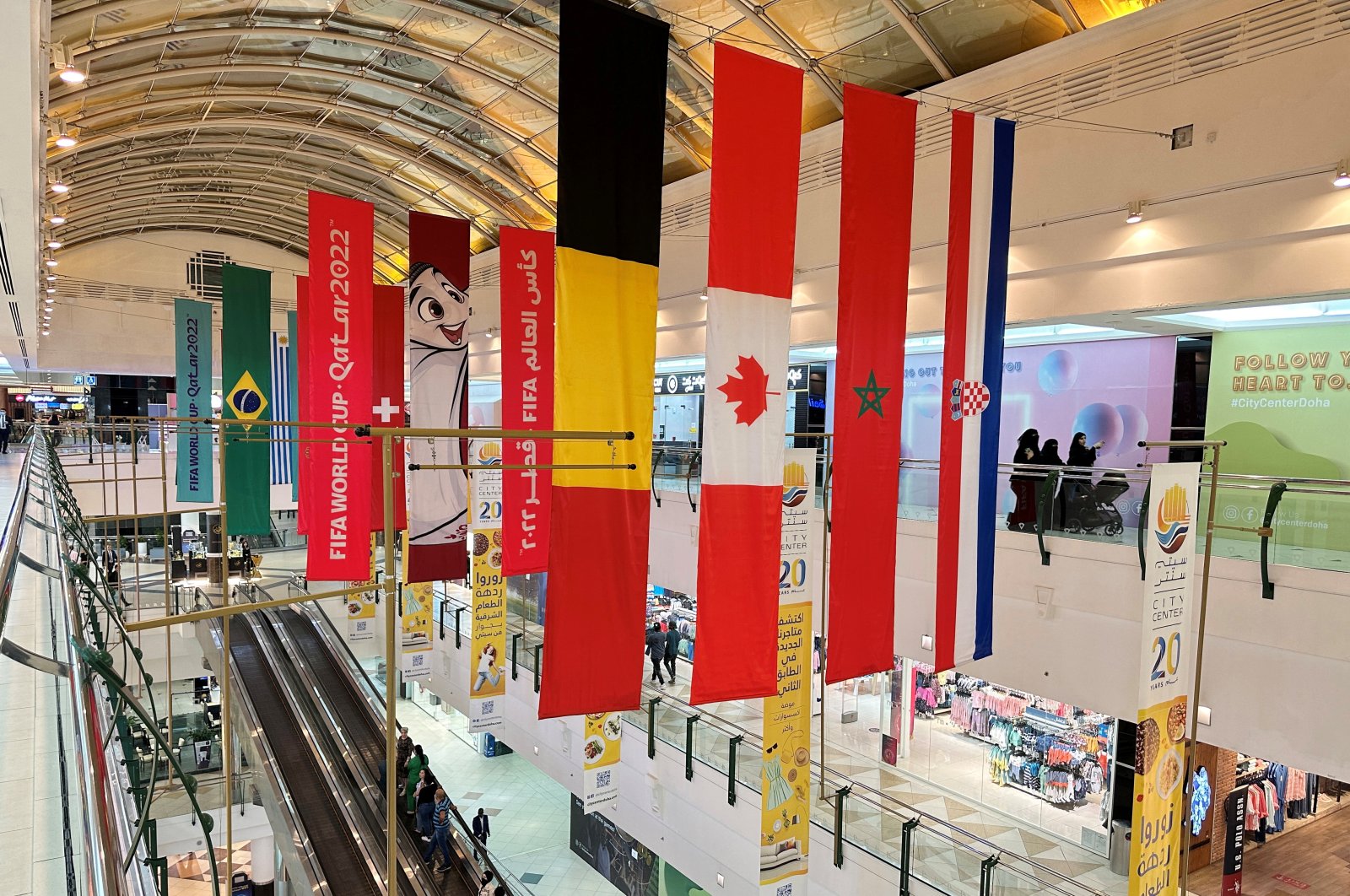 Flags of countries qualified for the Qatar World Cup 2022 are seen at a shopping mall in Doha, Oct. 19, 2022. (Reuters Photo)