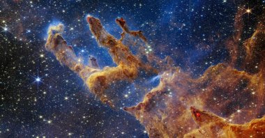 The "Pillars of Creation" reveals a kaleidoscope of colors in NASA's James Webb Space Telescope's near-infrared-light view, Oct. 19, 2022. (NASA via AFP)