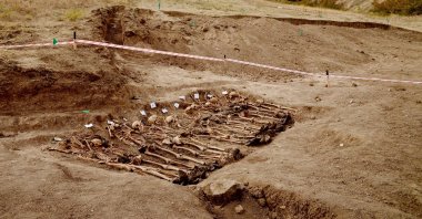 A picture taken on Oct. 4, 2022 shows human remains at the site of a mass grave discovered in the village of Edilli. (AFP File Photo)
