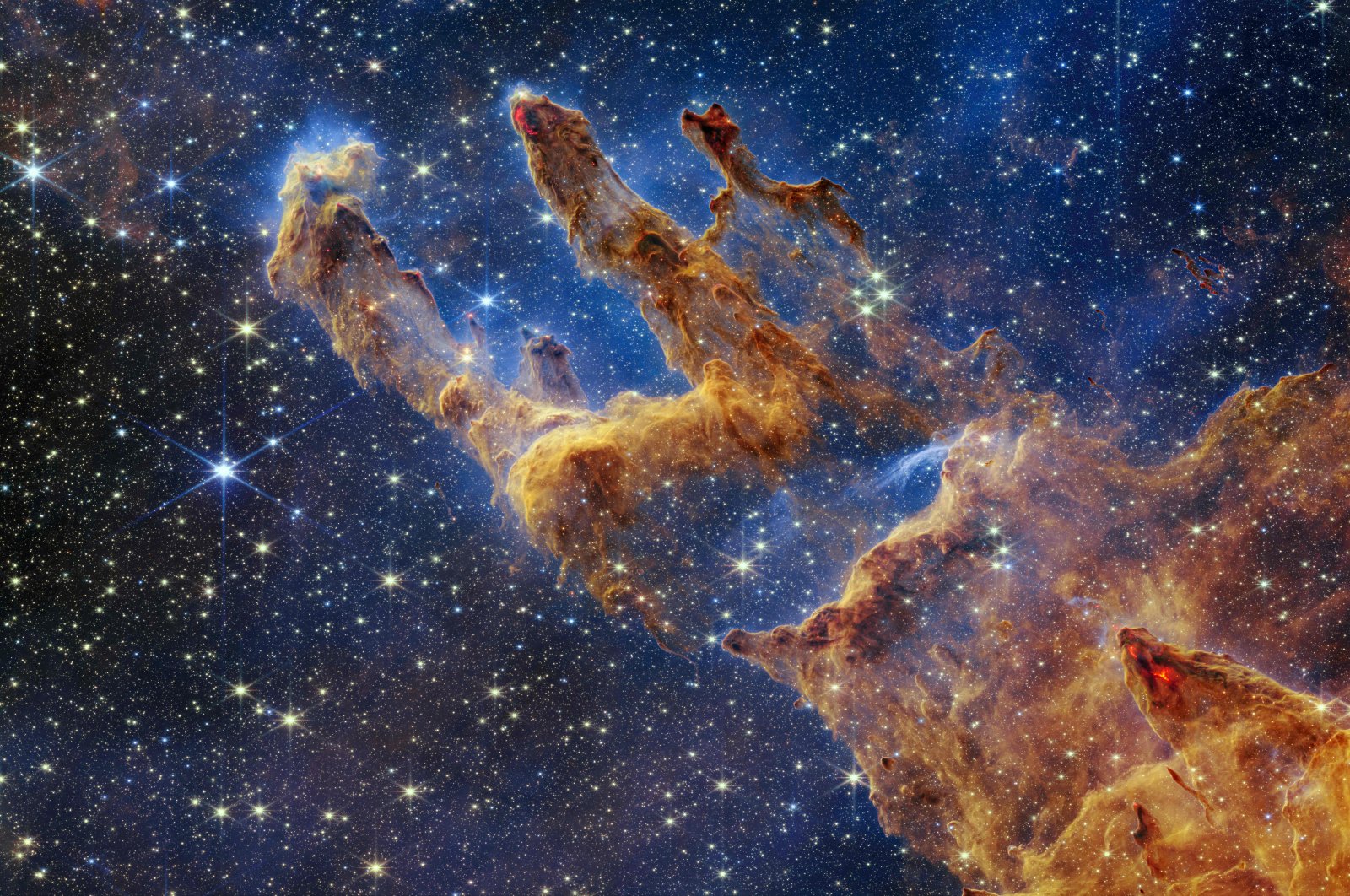 The &quot;Pillars of Creation&quot; reveals a kaleidoscope of colors in NASA&#039;s James Webb Space Telescope&#039;s near-infrared-light view, Oct. 19, 2022. (NASA via AFP)