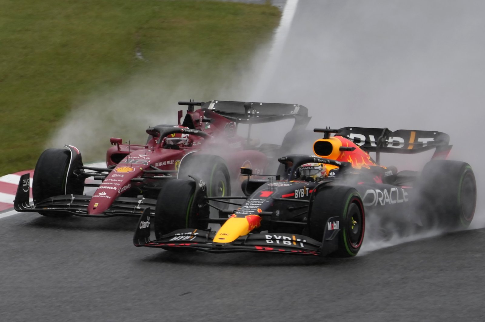 Red Bull driver Max Verstappen of the Netherlands (R) and Ferrari driver Charles Leclerc of Monaco compete during the Japanese Formula One Grand Prix at the Suzuka Circuit, Suzuka, Japan, Oct. 9, 2022. (AP Photo)