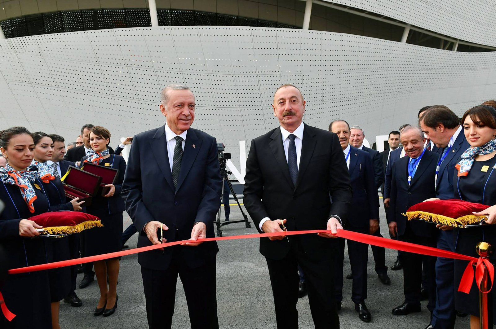 President Recep Tayyip Erdoğan (L) and Azerbaijani President Ilham Aliyev (R) cutting the ribbon during the inauguration ceremony of Zangilan International Airport, Zangilan, Azerbaijan, Oct. 20, 2022. (Press Service of the President of Azerbaijan via AFP)
