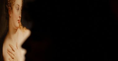 A woman stands in front of a replica of Peter Paul Rubens' "Venus and Cupid" showing a mastectomized breast, as part of a project between the Cultura en Vena Foundation and Thyssen-Bornemisza Museum on International Breast Cancer Awareness Day in Madrid, Spain, Oct. 19, 2022. (Reuters Photo)