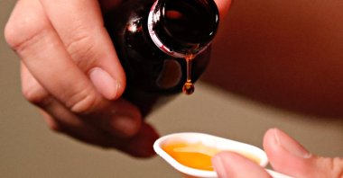 A cough medication is poured, Oct. 19, 2022. (Reuters Photo)