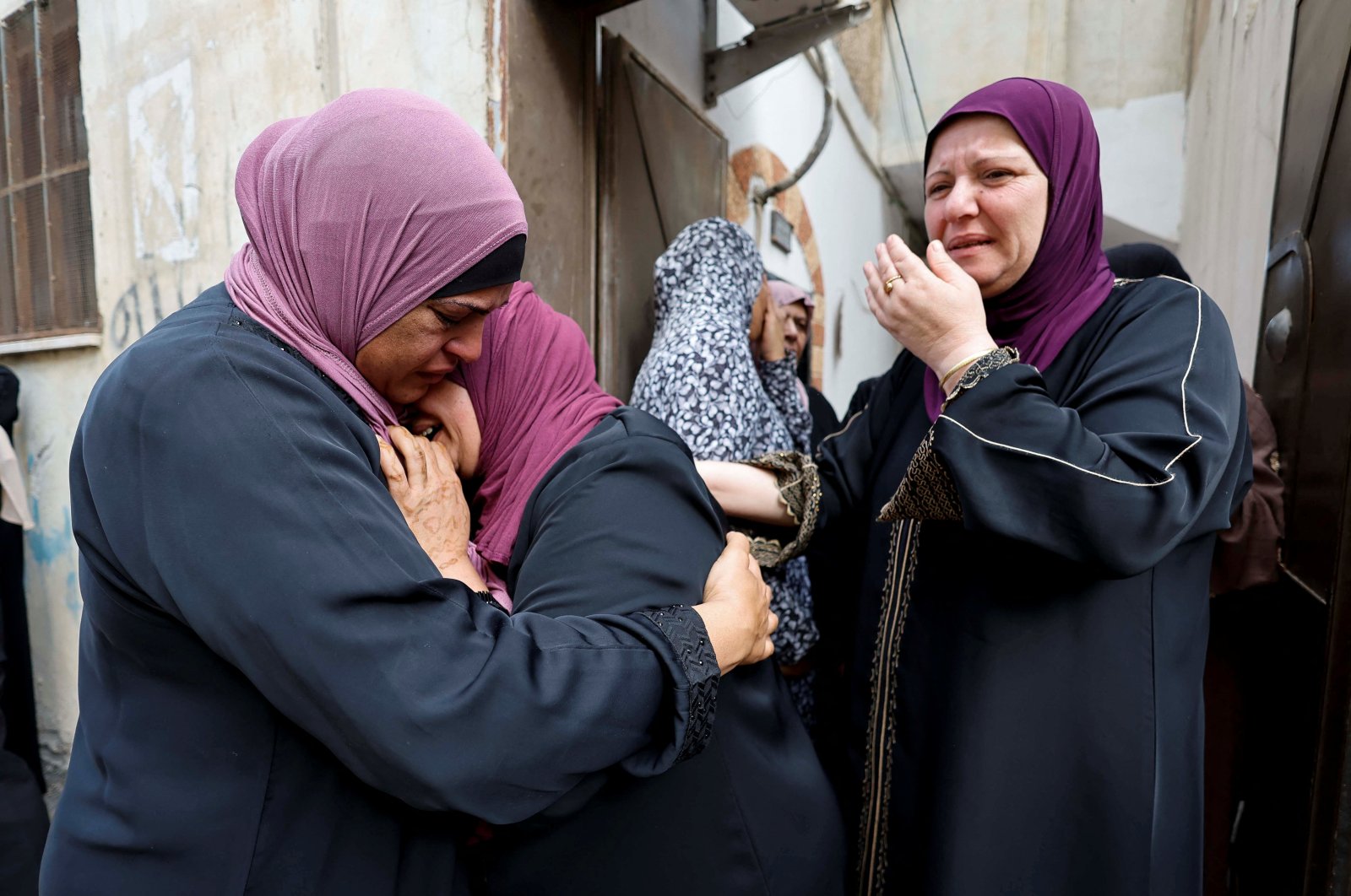 Women mourn during the funeral of Palestinian Salah Al-Buraiki, who was killed by Israeli forces during clashes in a raid, Jenin, Israeli-occupied West Bank, Oct. 21, 2022. (Reuters Photo)