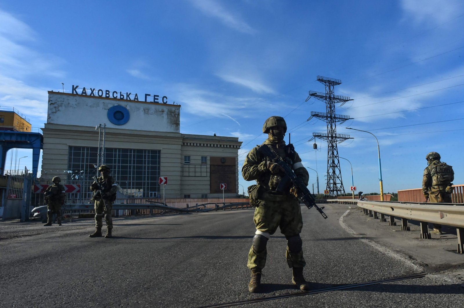 Russian servicemen patrol at the Kakhovka Hydroelectric Power Plant, Kherson Oblast, Ukraine, May 20, 2022. (AFP Photo)