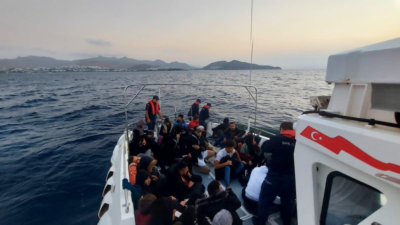 Irregular migrants pushed back by Greece are rescued by the Turkish coast guard off Bodrum in this undated file photo. (DHA File Photo)
