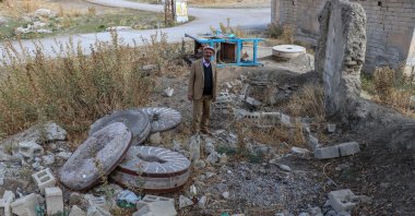 Earthquake survivor Ferzende Zan stands amid ruins of the mill he used to work at, in Van, eastern Türkiye, Oct. 22, 2022. (AA Photo)