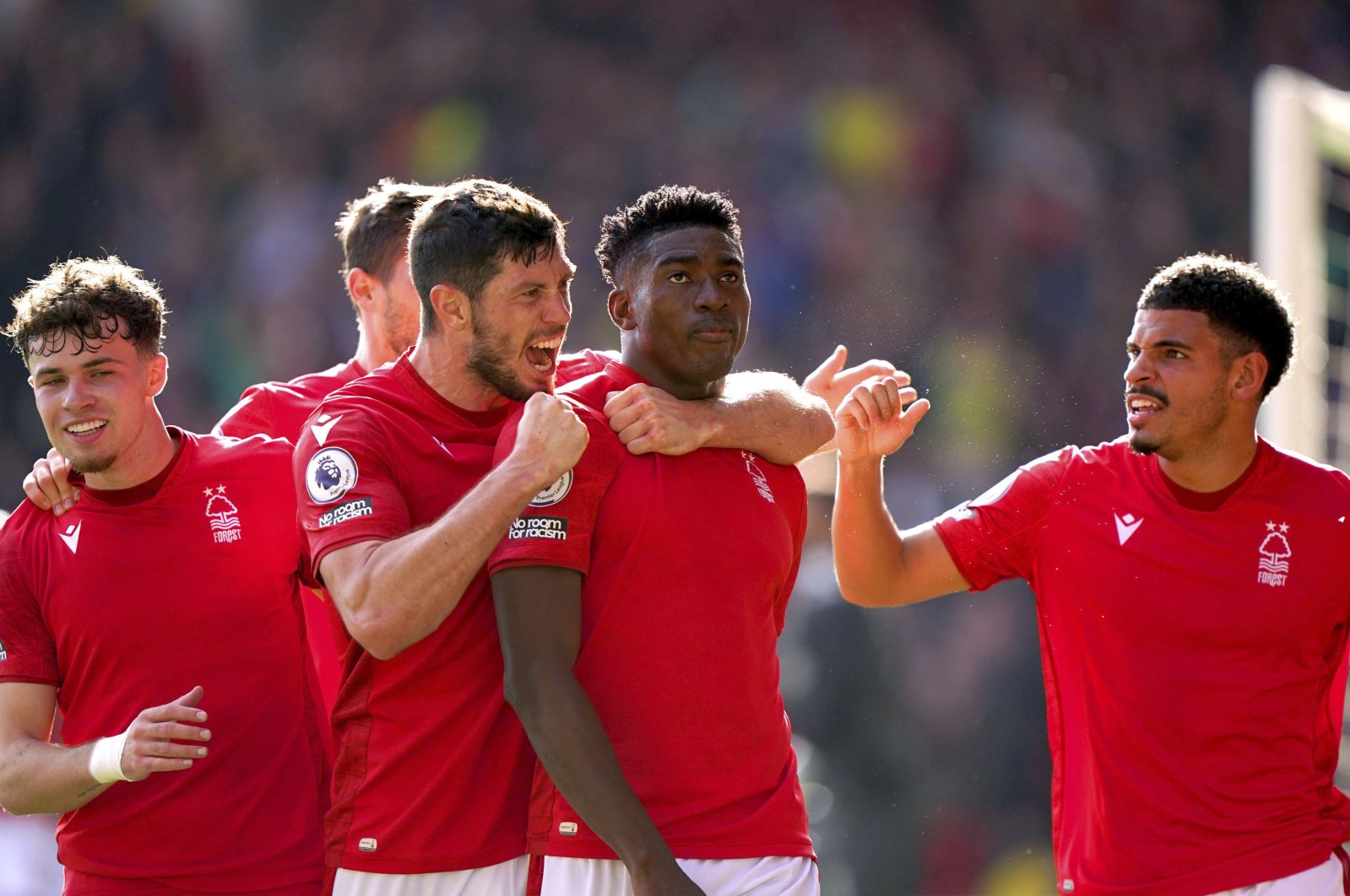 Nottingham Forest players celebrate a goal in a Premier League match against Liverpool, Nottingham, the U.K., Oct. 22, 2022. (AP Photo)