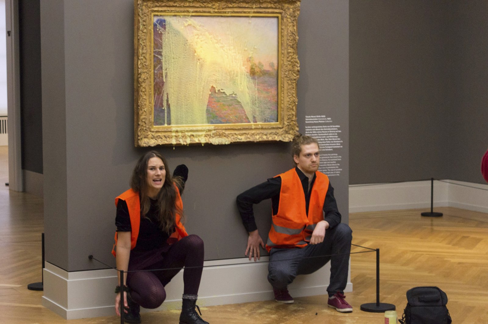 Climate protesters of Last Generation after throwing mashed potatoes at the Claude Monet painting &quot;Les Meules&quot; at Potsdam’s Barberini Museum, Germany, Oct. 24, 2022. (AP Photo)